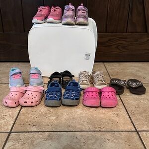 Various shoes: sneakers, dress shoes, sandals in various conditions